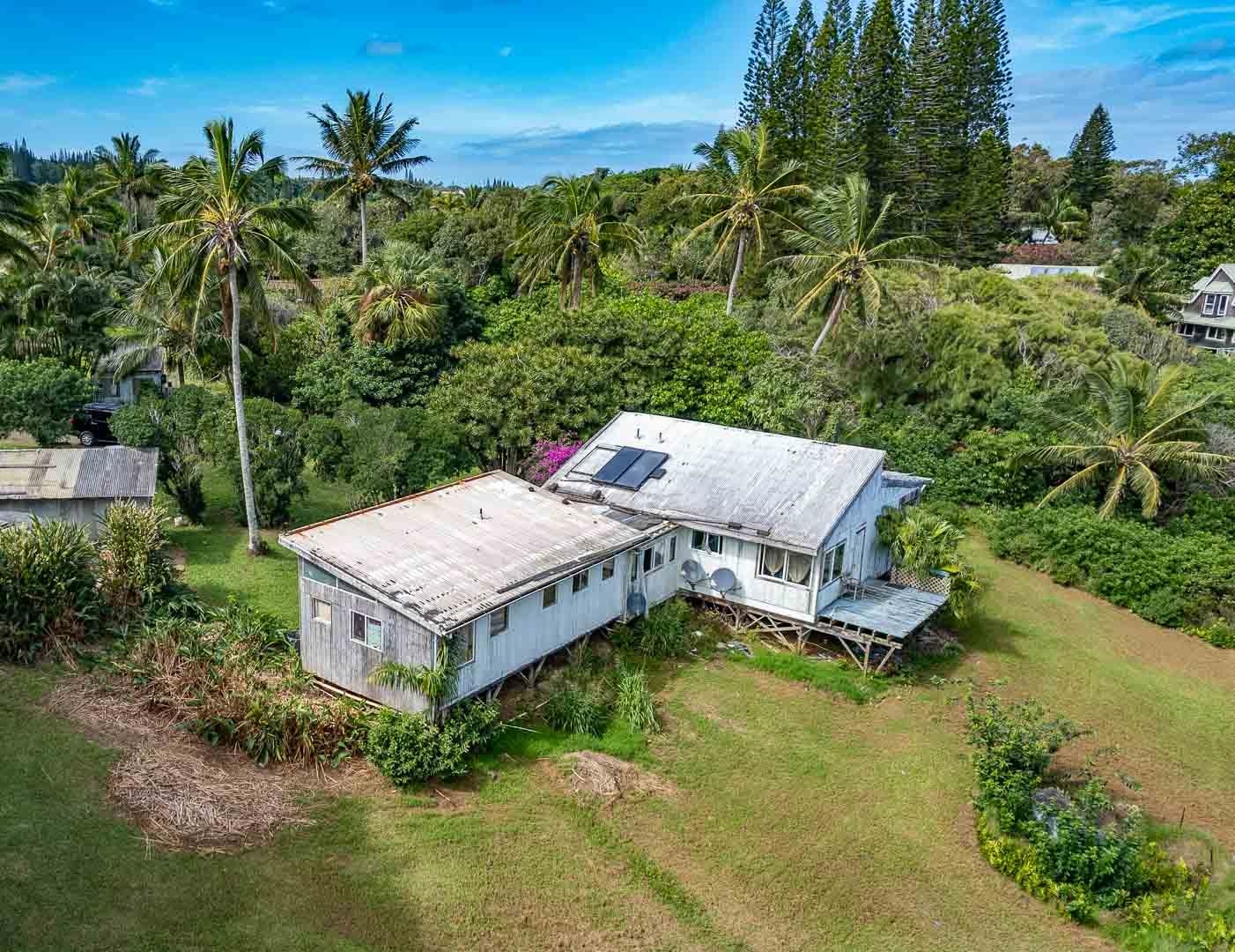 210 Door Of Faith Road Haiku, HI 96708 - Photo 24 of 46 an aerial view of a house with a yard