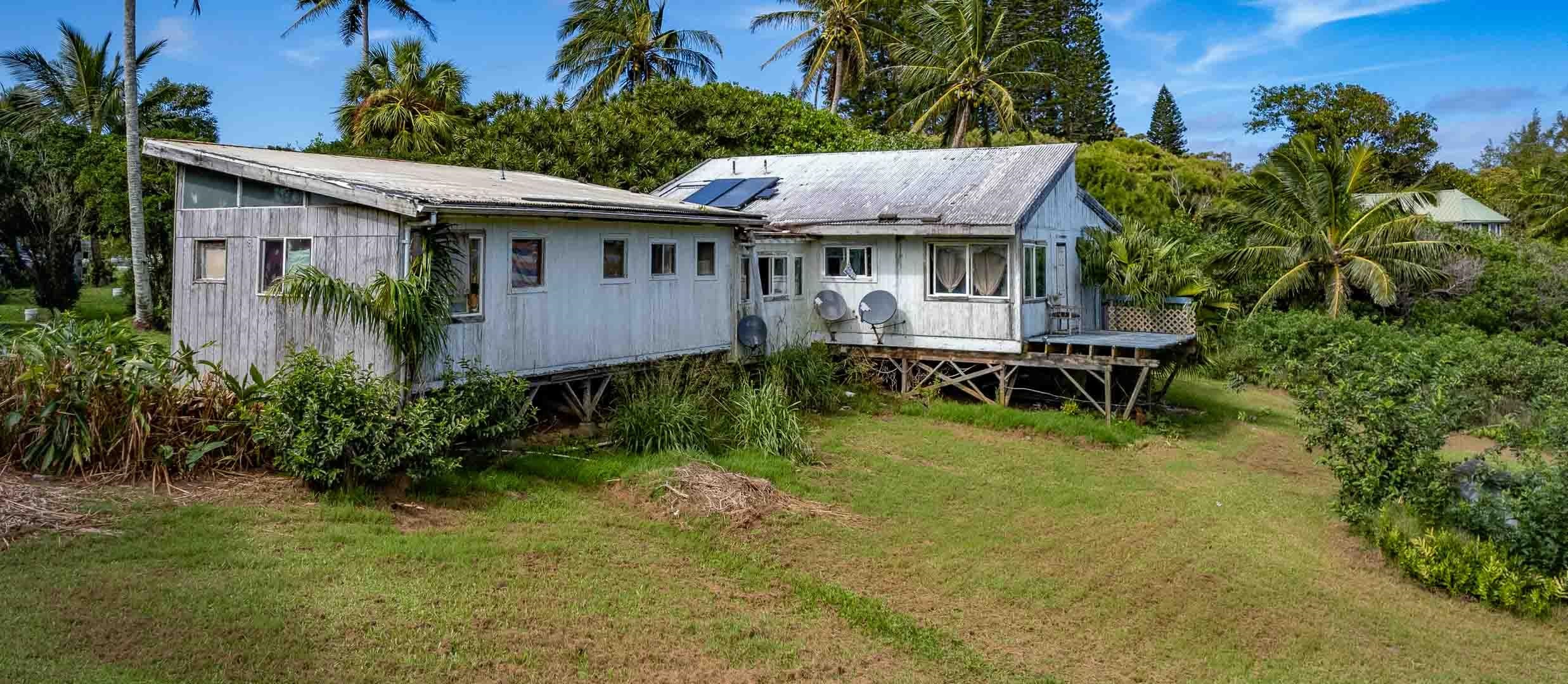 210 Door Of Faith Road Haiku, HI 96708 - Photo 26 of 46 a view of a house with a yard patio and sitting area