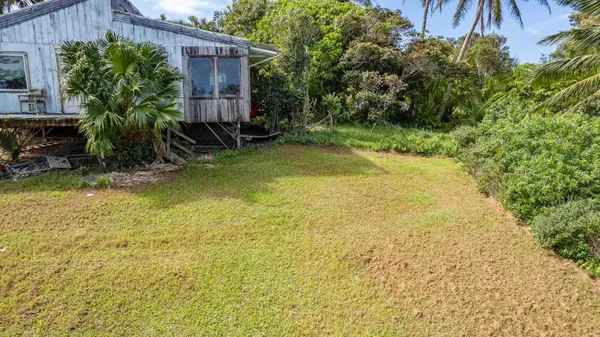 a view of a house and a yard