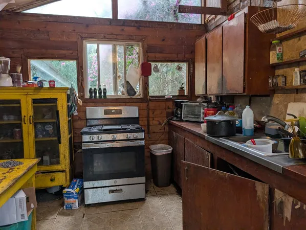 a bathroom with a toilet sink and curtain