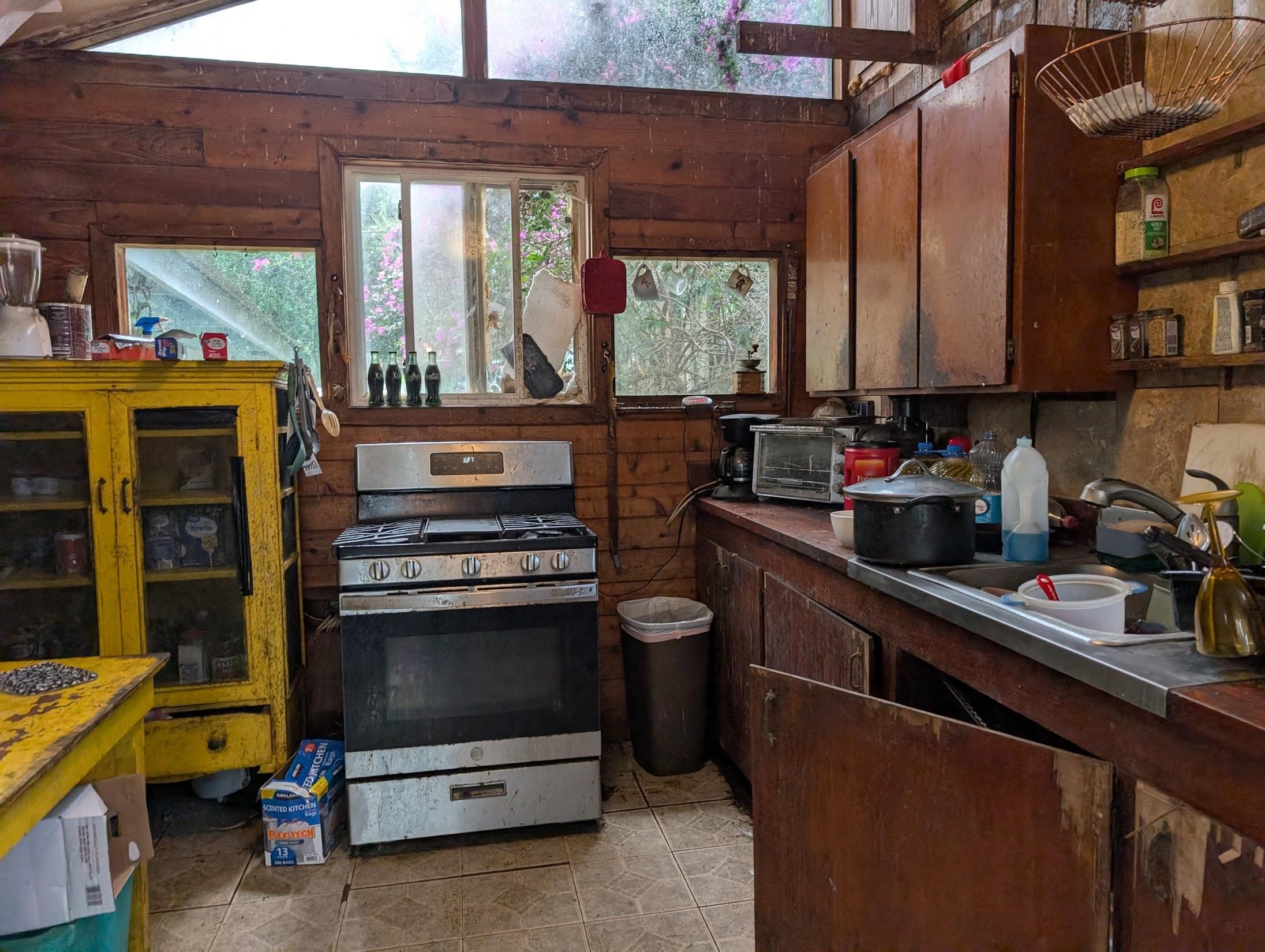 210 Door Of Faith Road Haiku, HI 96708 - Photo 35 of 46 a kitchen that has a sink and a stove