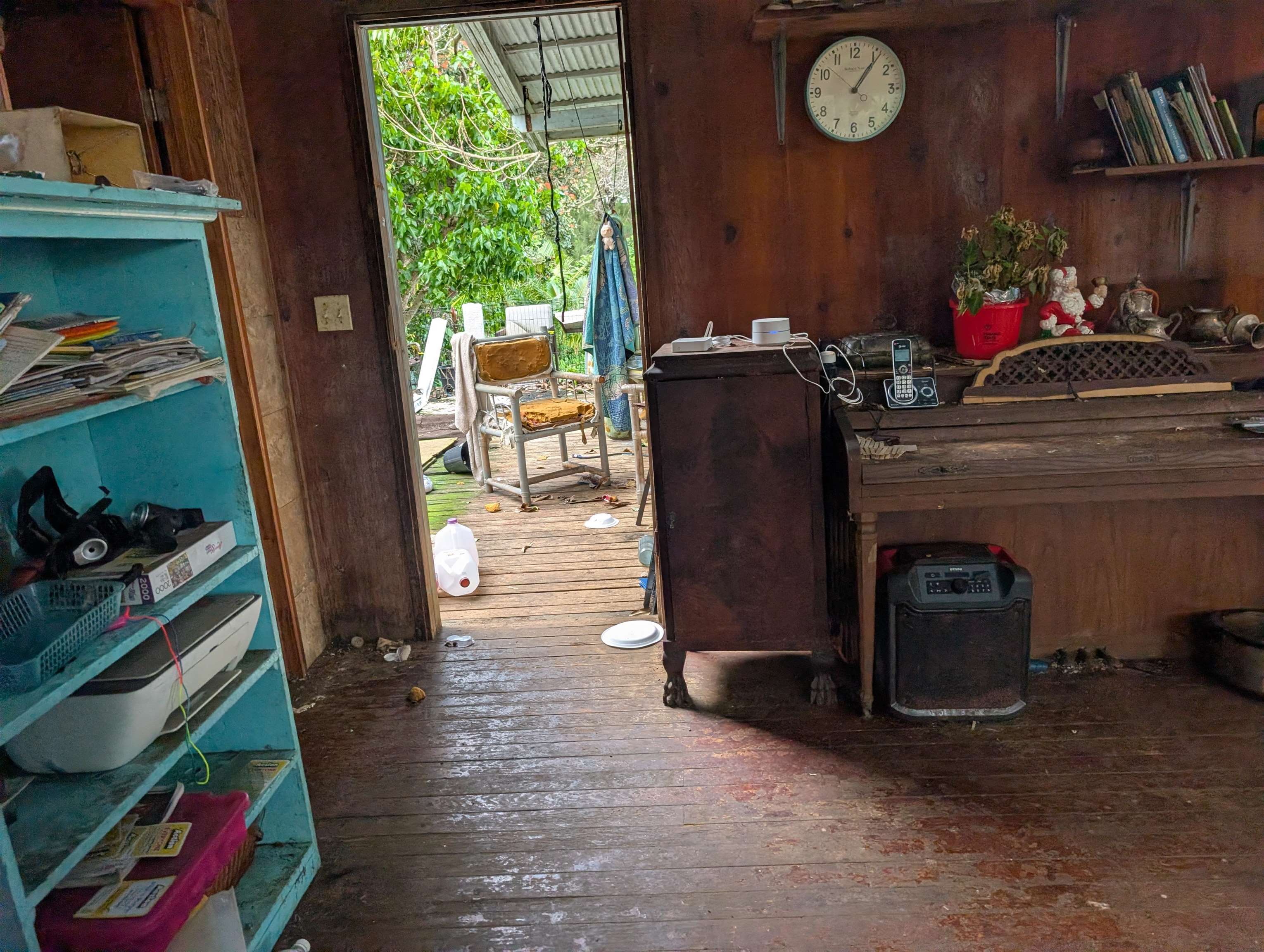 210 Door Of Faith Road Haiku, HI 96708 - Photo 38 of 46 a room with wooden floor and furniture