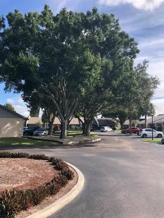 a view of a park with swings and slides