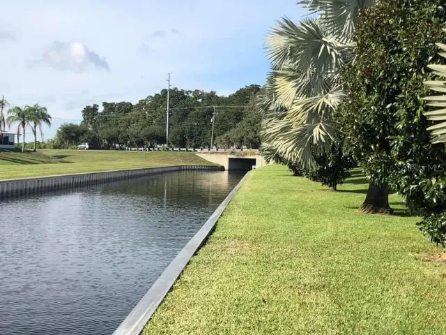 a view of a lake with a yard