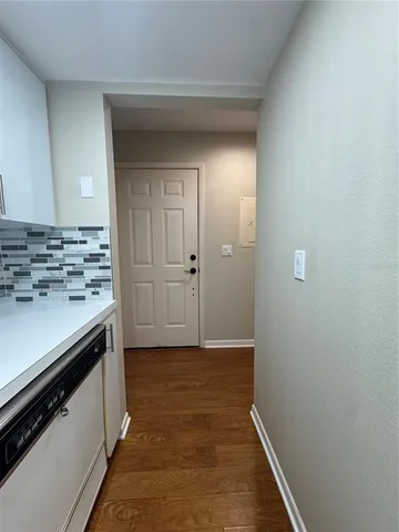 a kitchen with stainless steel appliances a stove a sink and a refrigerator