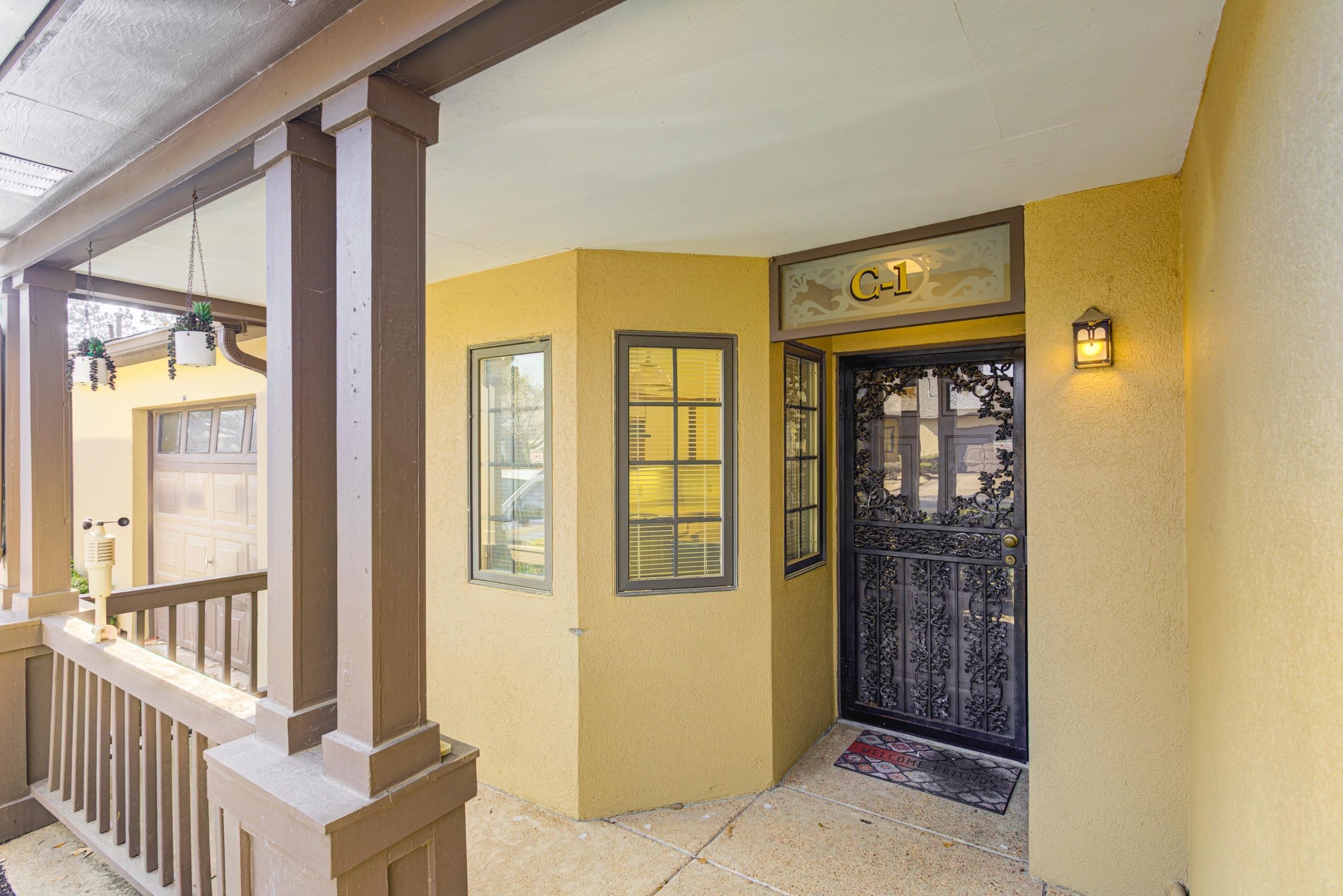 5013 Scheibler Road, Unit C1 Memphis, TN 38128 - Photo 3 of 36 View of exterior entry with stucco siding
