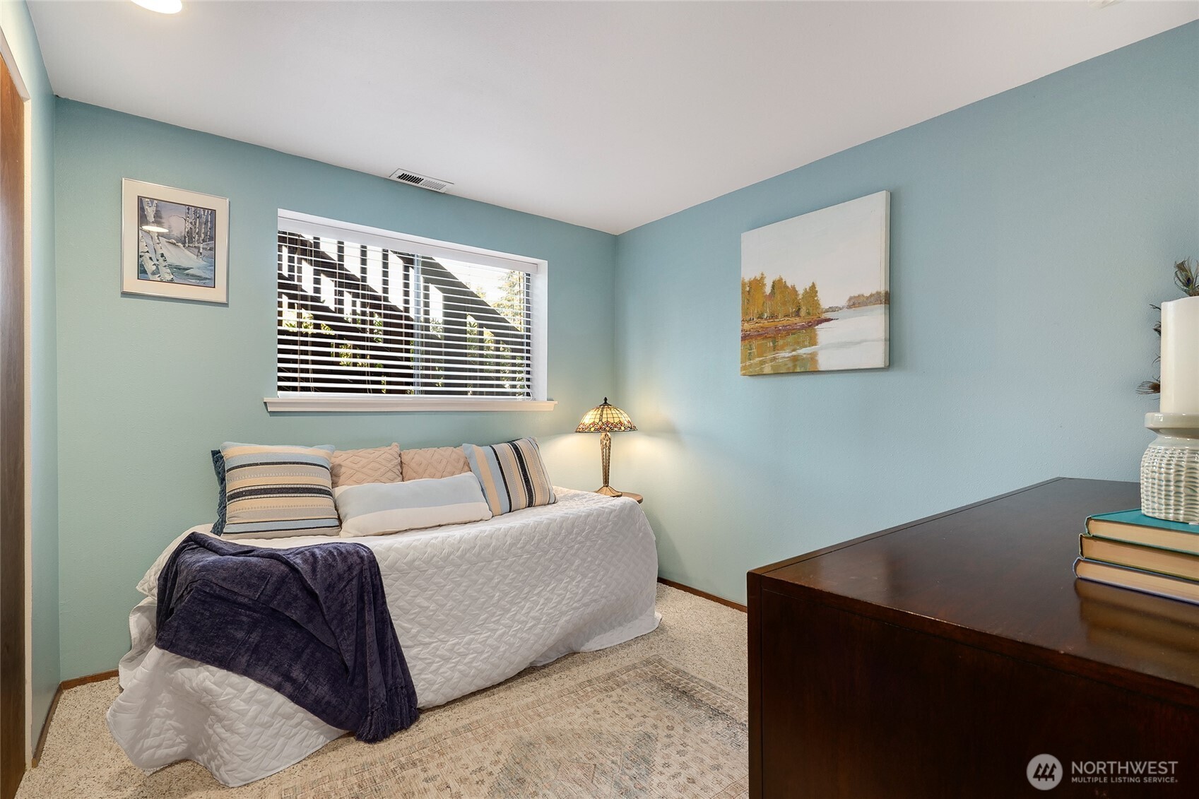 6809 Southwest Maury Park Road Vashon, WA 98070 - Photo 24 of 37 a bedroom with a bed and a window