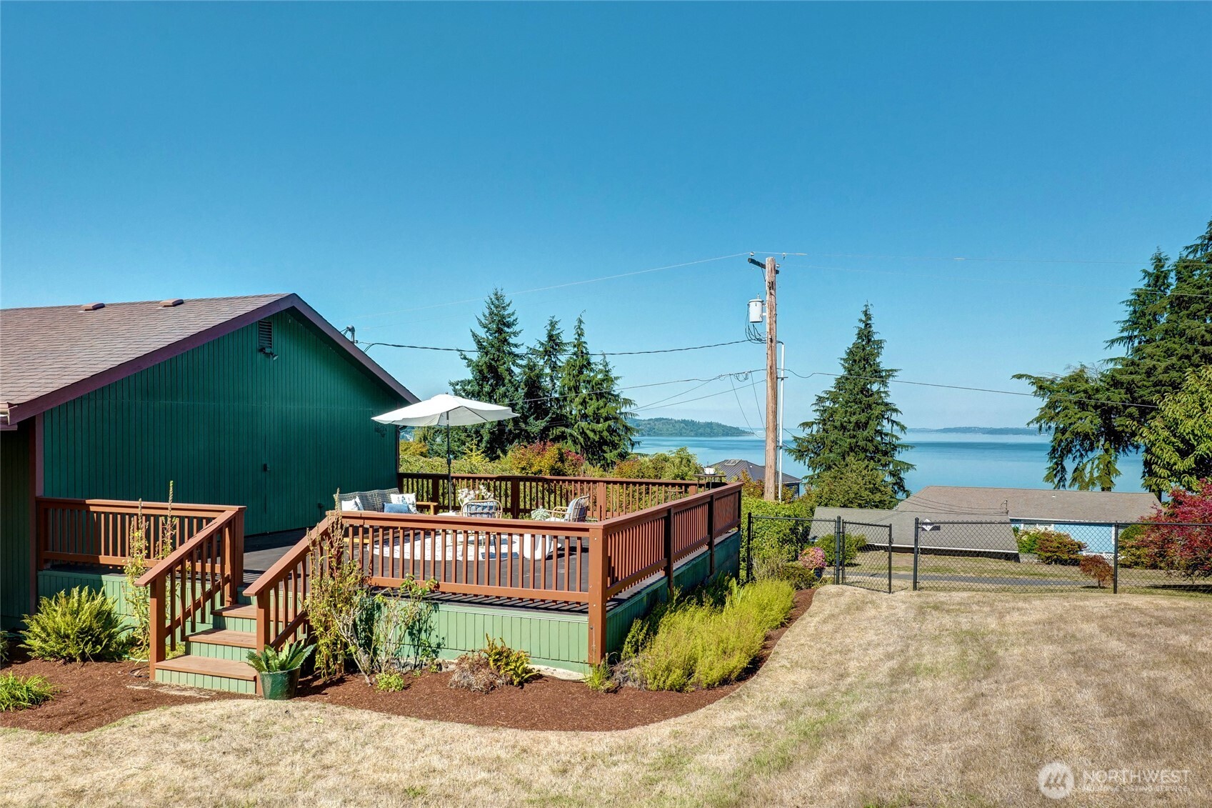 6809 Southwest Maury Park Road Vashon, WA 98070 - Photo 29 of 37 a view of a chairs and table in the backyard