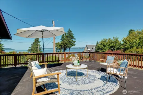 swimming pool view with a seating space