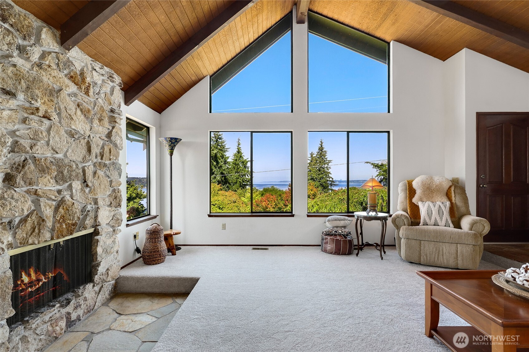 6809 Southwest Maury Park Road Vashon, WA 98070 - Photo 3 of 37 a living room with furniture and a fireplace