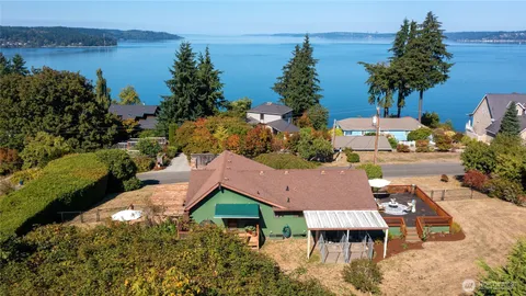 an aerial view of multiple houses with yard