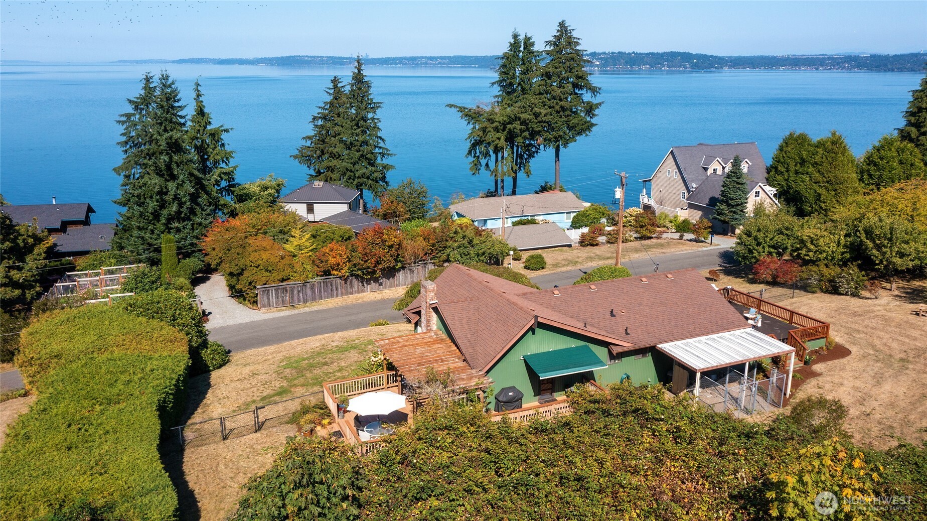 6809 Southwest Maury Park Road Vashon, WA 98070 - Photo 34 of 37 a view of a backyard with plants and outdoor seating