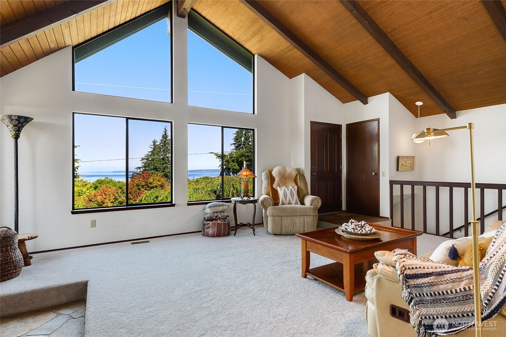 6809 Southwest Maury Park Road Vashon, WA 98070 - Photo 4 of 37 a balcony with furniture and a potted plant
