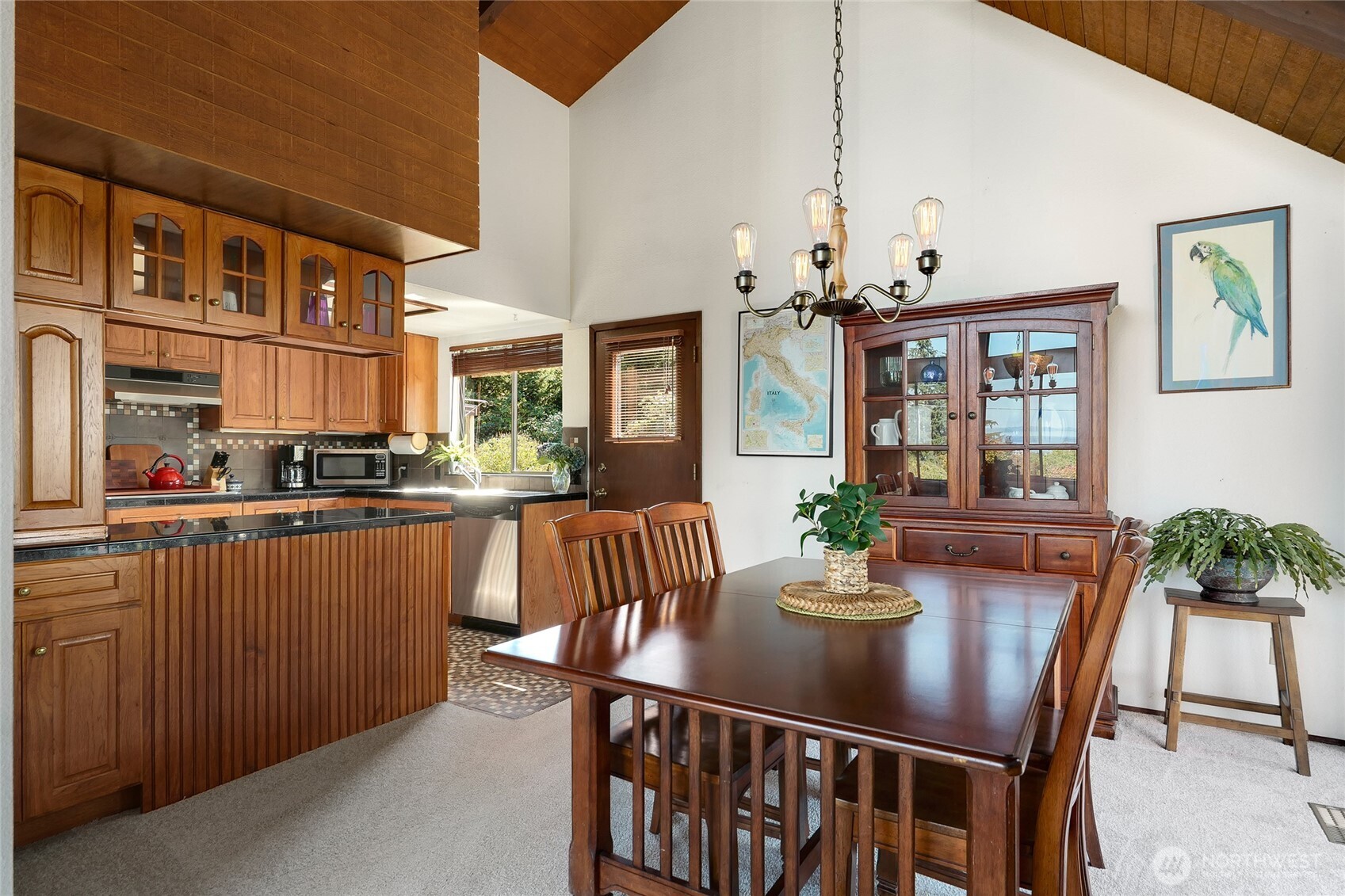 6809 Southwest Maury Park Road Vashon, WA 98070 - Photo 9 of 37 a dining room with furniture a chandelier and window