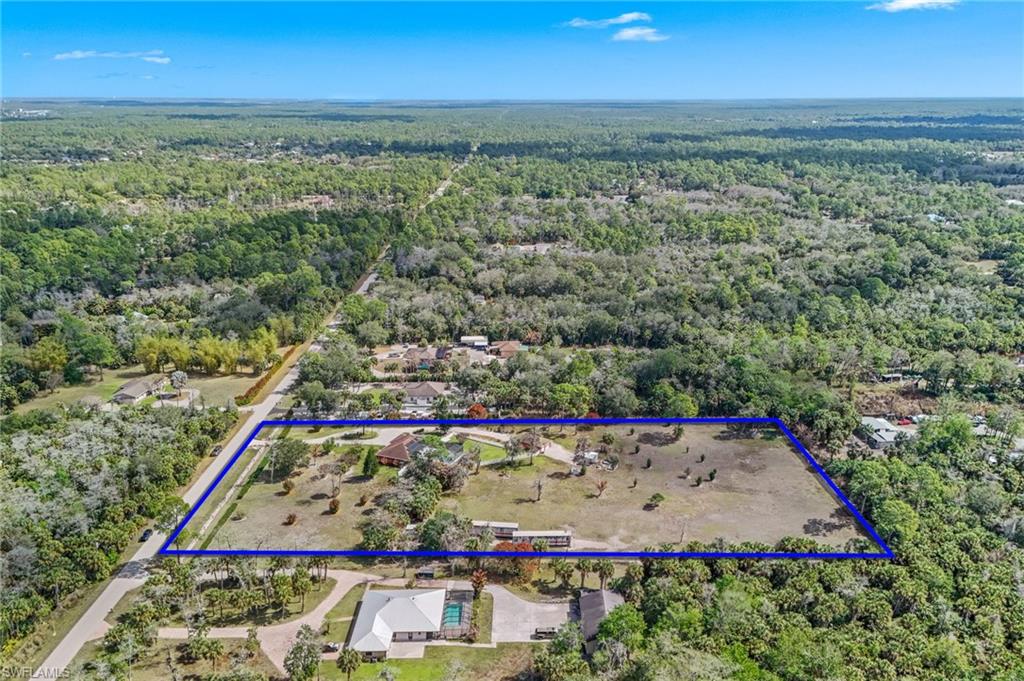 360 16th Avenue Northwest Naples, FL 34120 - Photo 24 of 25 an aerial view of residential houses with outdoor space and seating
