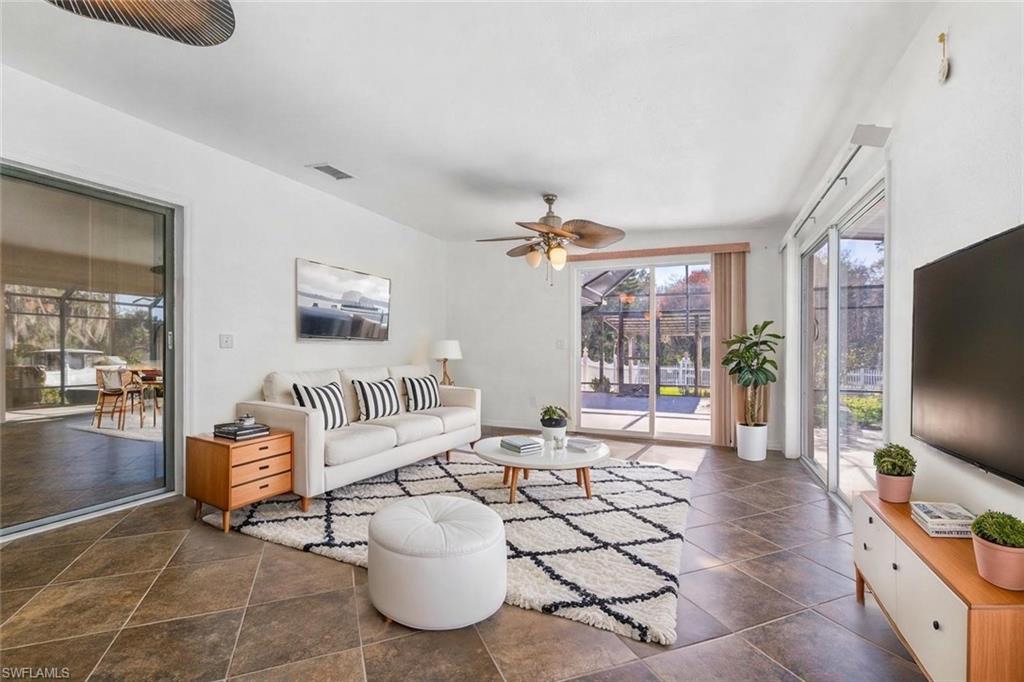 360 16th Avenue Northwest Naples, FL 34120 - Photo 5 of 25 a living room with furniture and a flat screen tv