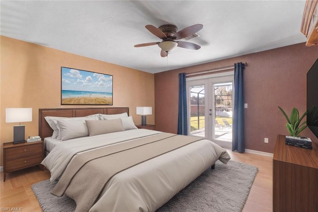 360 16th Avenue Northwest Naples, FL 34120 - Photo 10 of 25 a bedroom with a large bed and a window