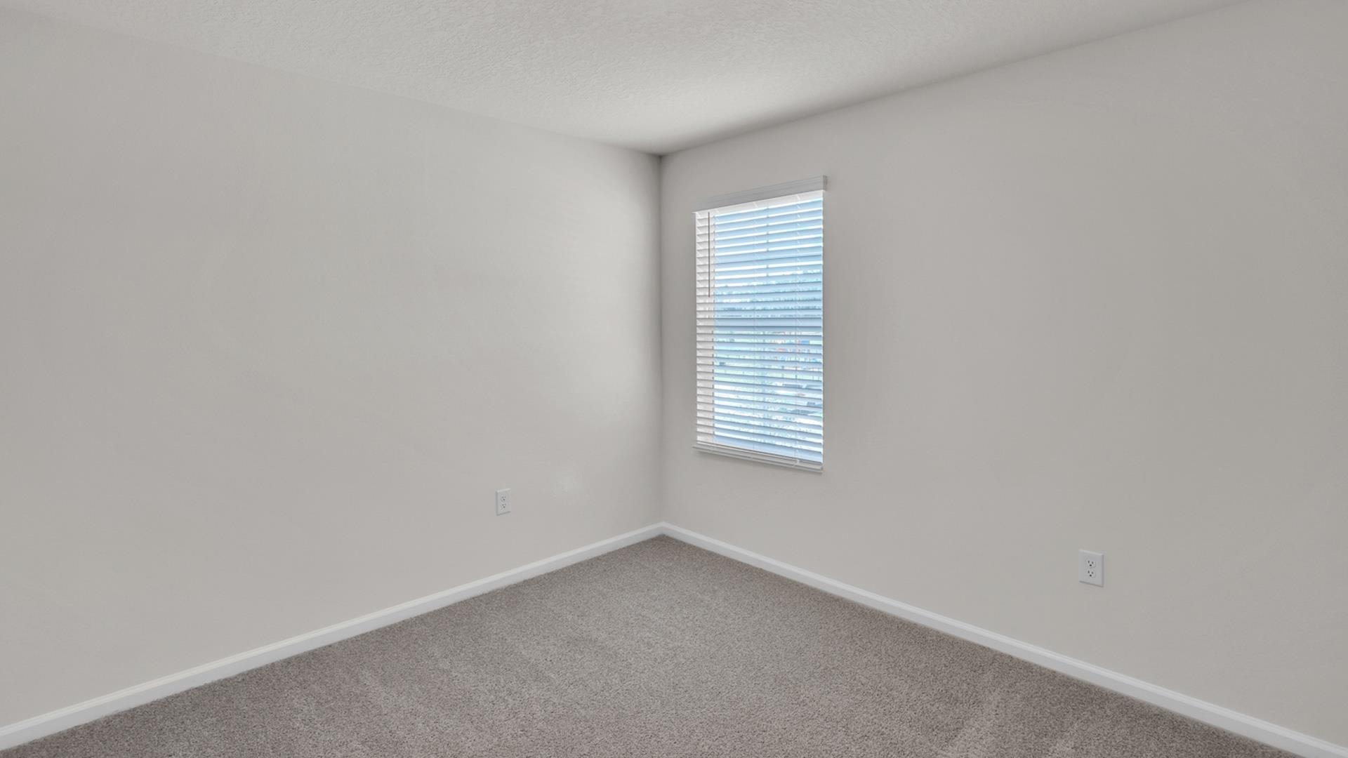 123 Redbud Road Palm Coast, FL 32137 - Photo 15 of 29 a view of an empty room with a window