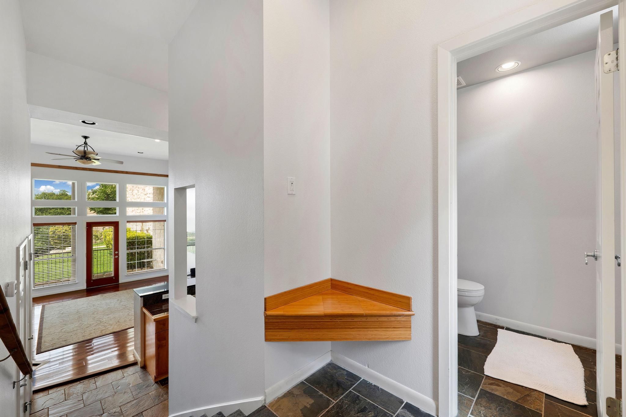 2918 Ranch Road 620, Unit J162 Austin, TX 78734 - Photo 16 of 26 Split-level entry with hall bath to the right here and convenient drop zone, a spacious living room with numerous windows, abundant windows and a glass-paneled door
