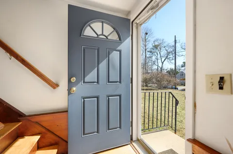 a view of front door with stairs