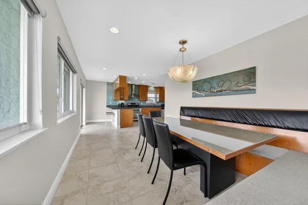a bathroom with a granite countertop double vanity sink and a mirror