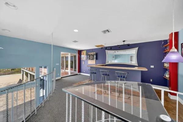 a view of a livingroom with furniture and a ceiling fan