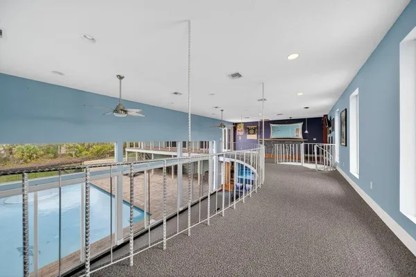 a view of a balcony with wooden floor and fence