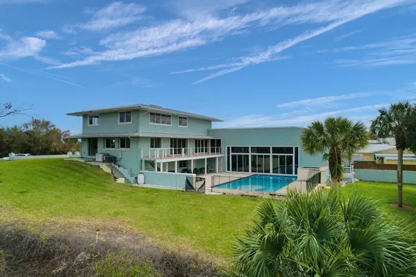 an aerial view of a house with a garden
