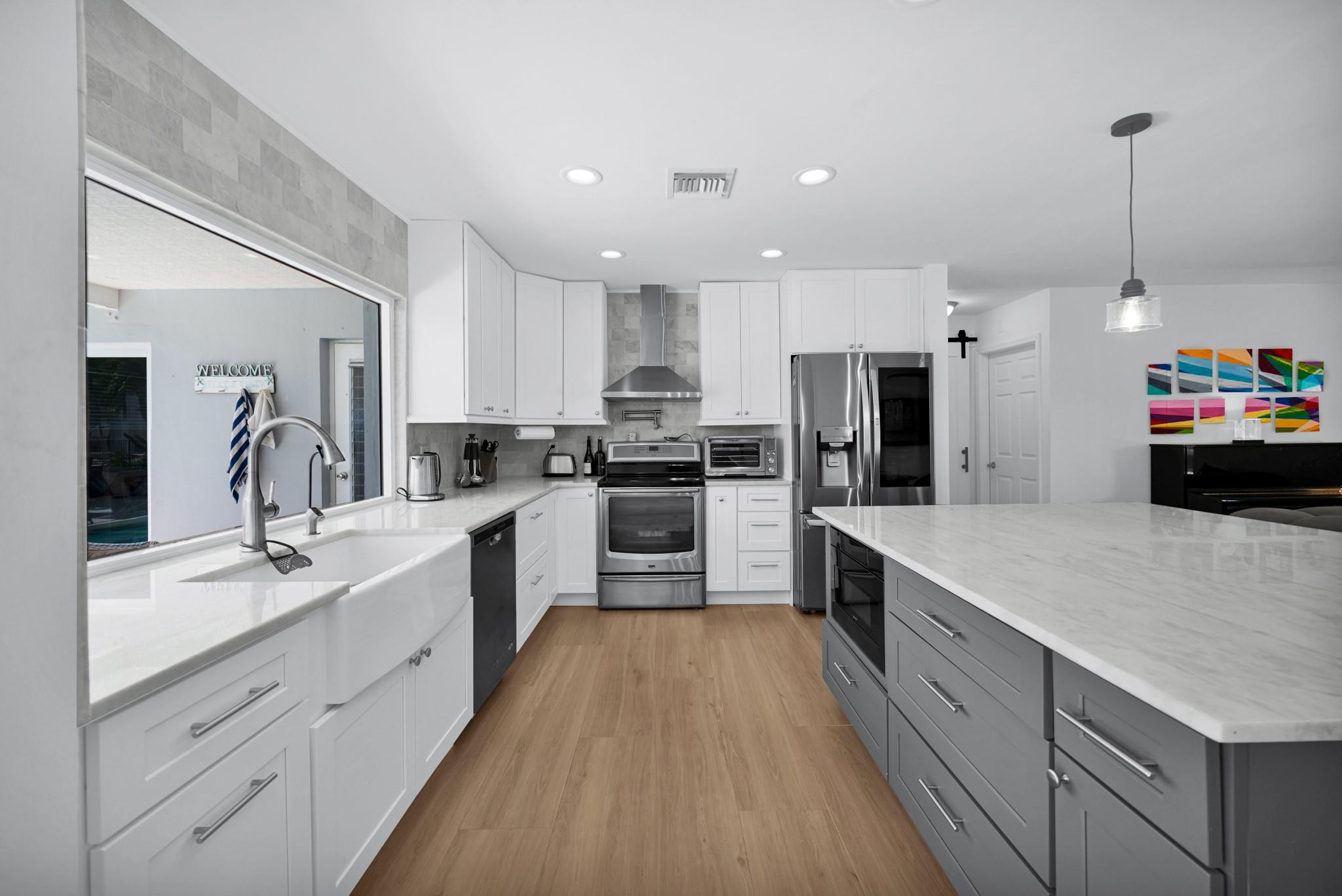252 Southwest 14th Place Boca Raton, FL 33432 - Photo 12 of 49 a large kitchen with stainless steel appliances lots of counter space sink and cabinets
