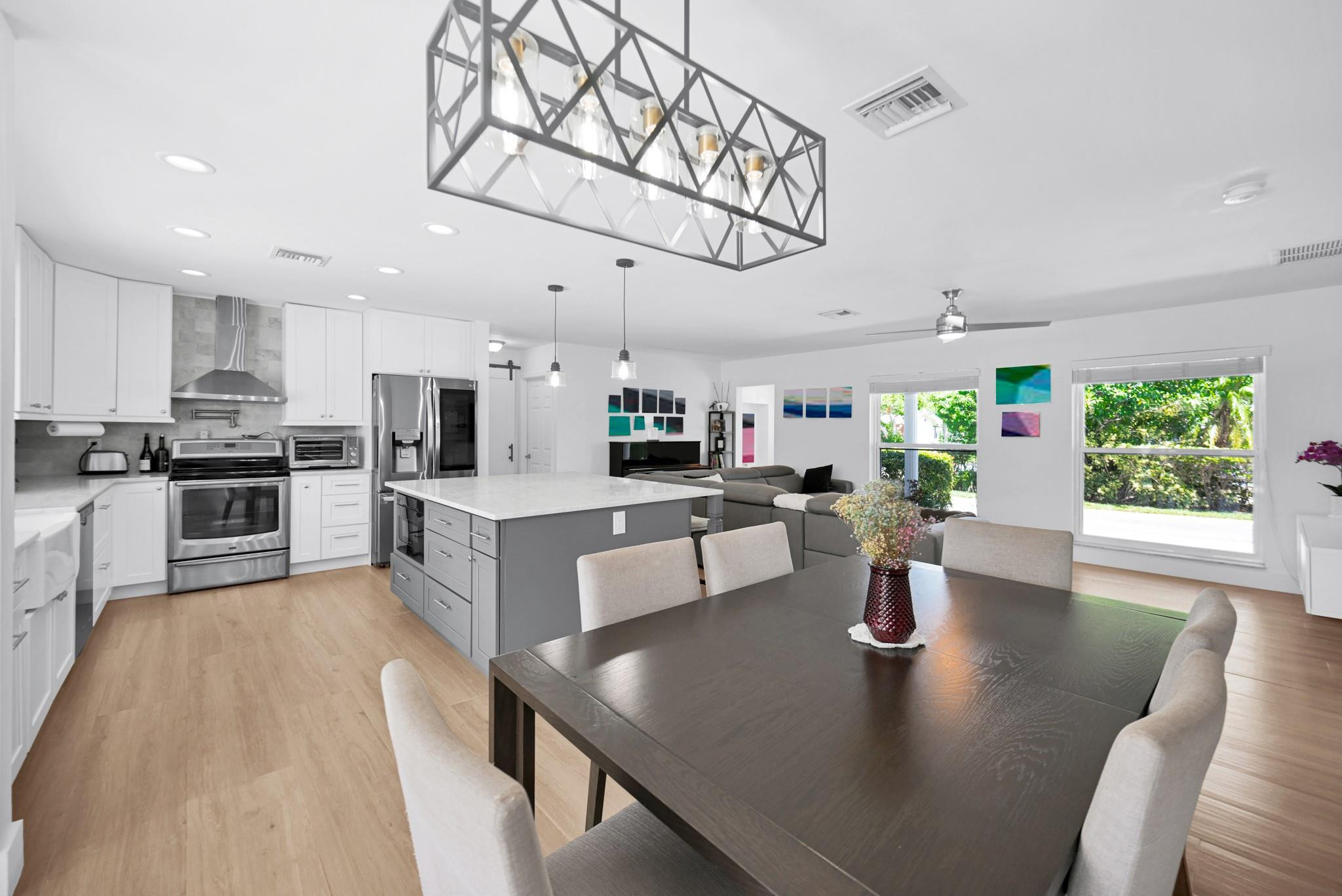 252 Southwest 14th Place Boca Raton, FL 33432 - Photo 16 of 49 a view of kitchen with dining table and chairs