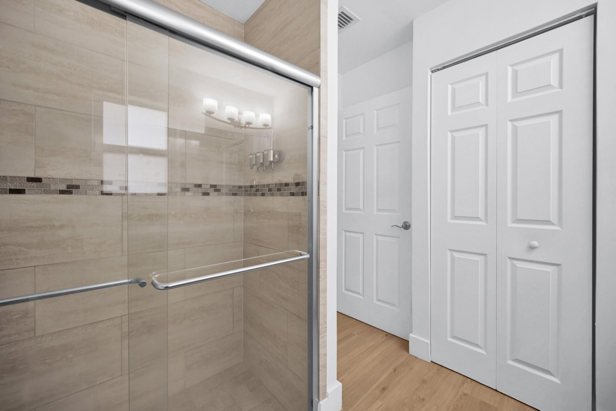 252 Southwest 14th Place Boca Raton, FL 33432 - Photo 22 of 49 a bathroom with a glass shower door