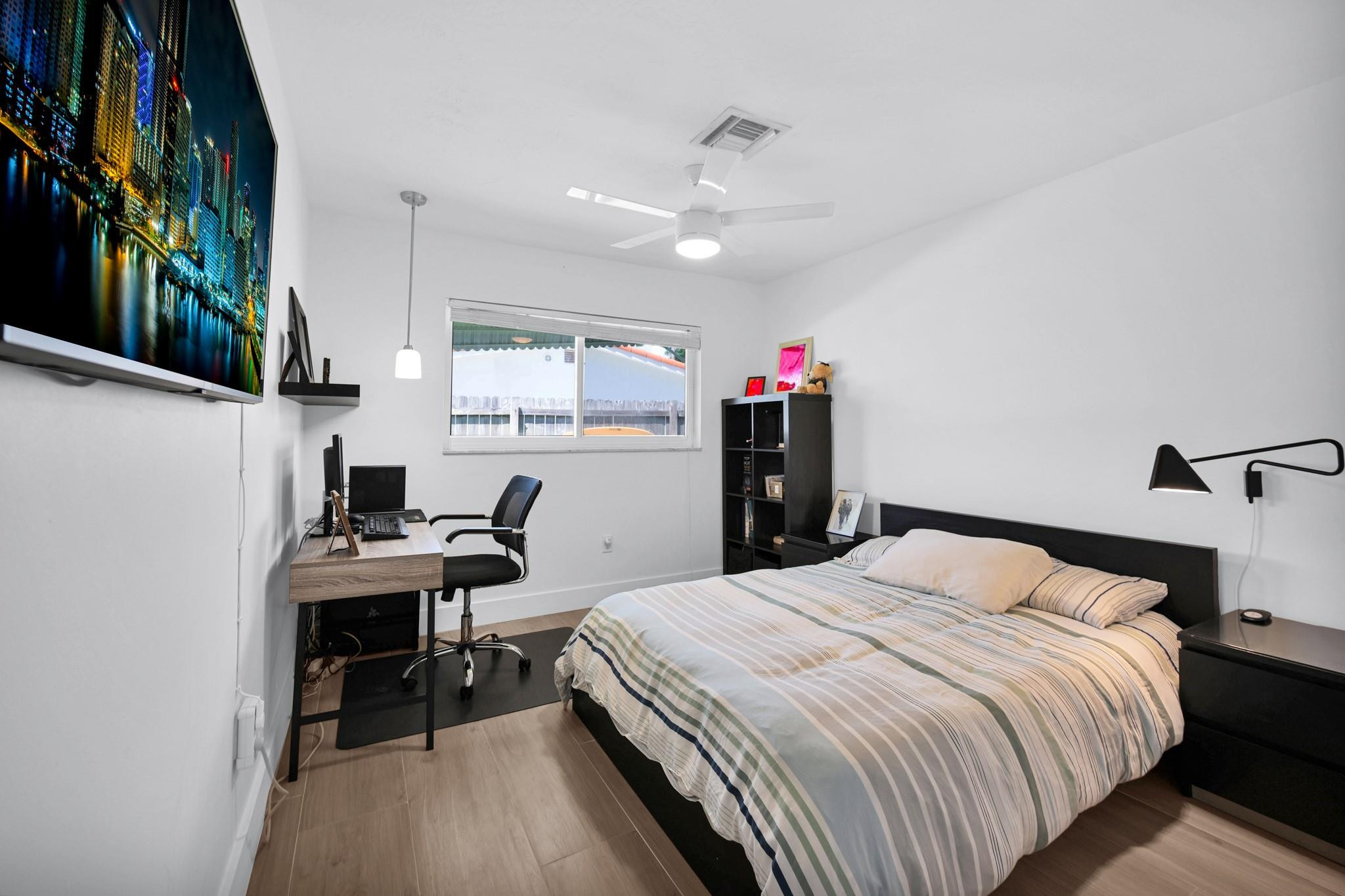 252 Southwest 14th Place Boca Raton, FL 33432 - Photo 23 of 49 a bedroom with a bed and a desk in it