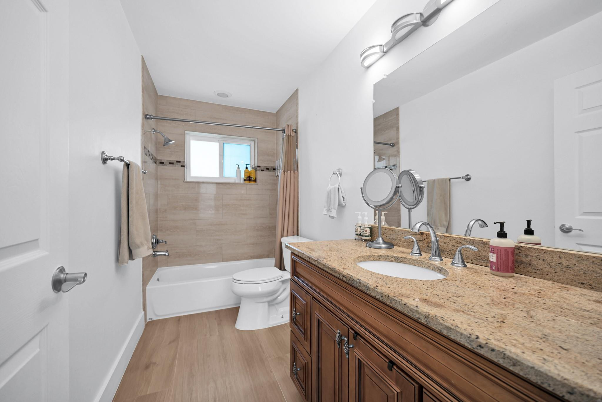 252 Southwest 14th Place Boca Raton, FL 33432 - Photo 27 of 49 a bathroom with a granite countertop sink a toilet a mirror and shower