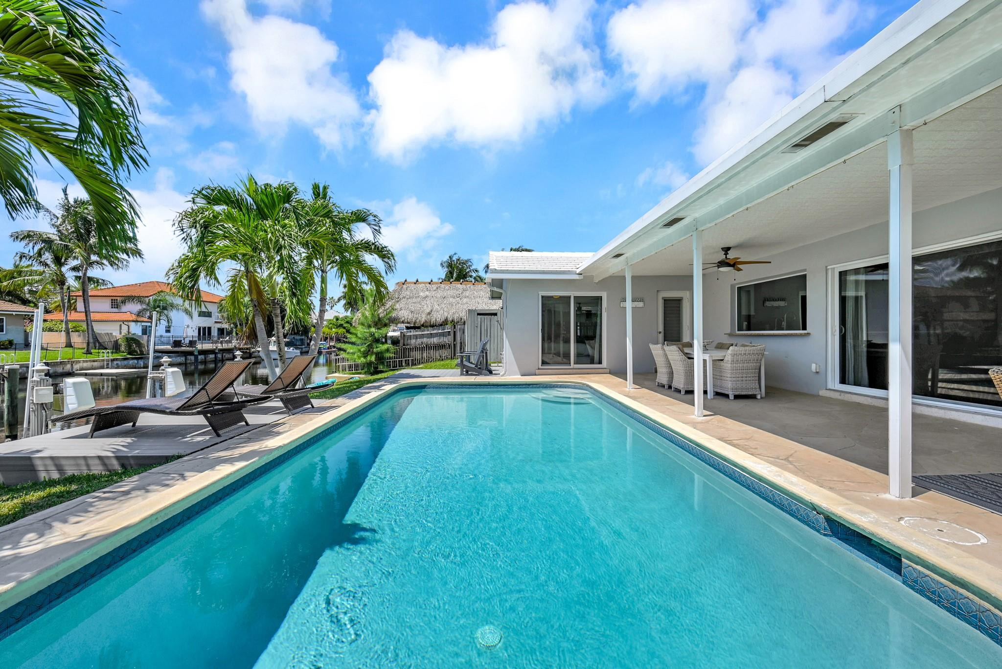 252 Southwest 14th Place Boca Raton, FL 33432 - Photo 32 of 49 a view of a house with swimming pool