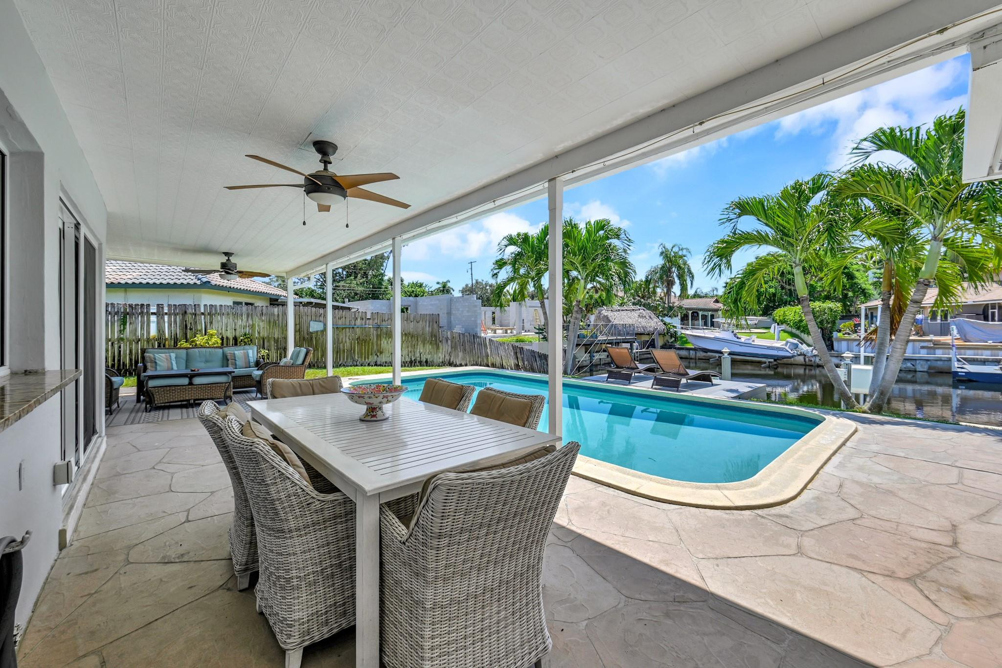 252 Southwest 14th Place Boca Raton, FL 33432 - Photo 34 of 49 a view of swimming pool with outdoor seating and plants