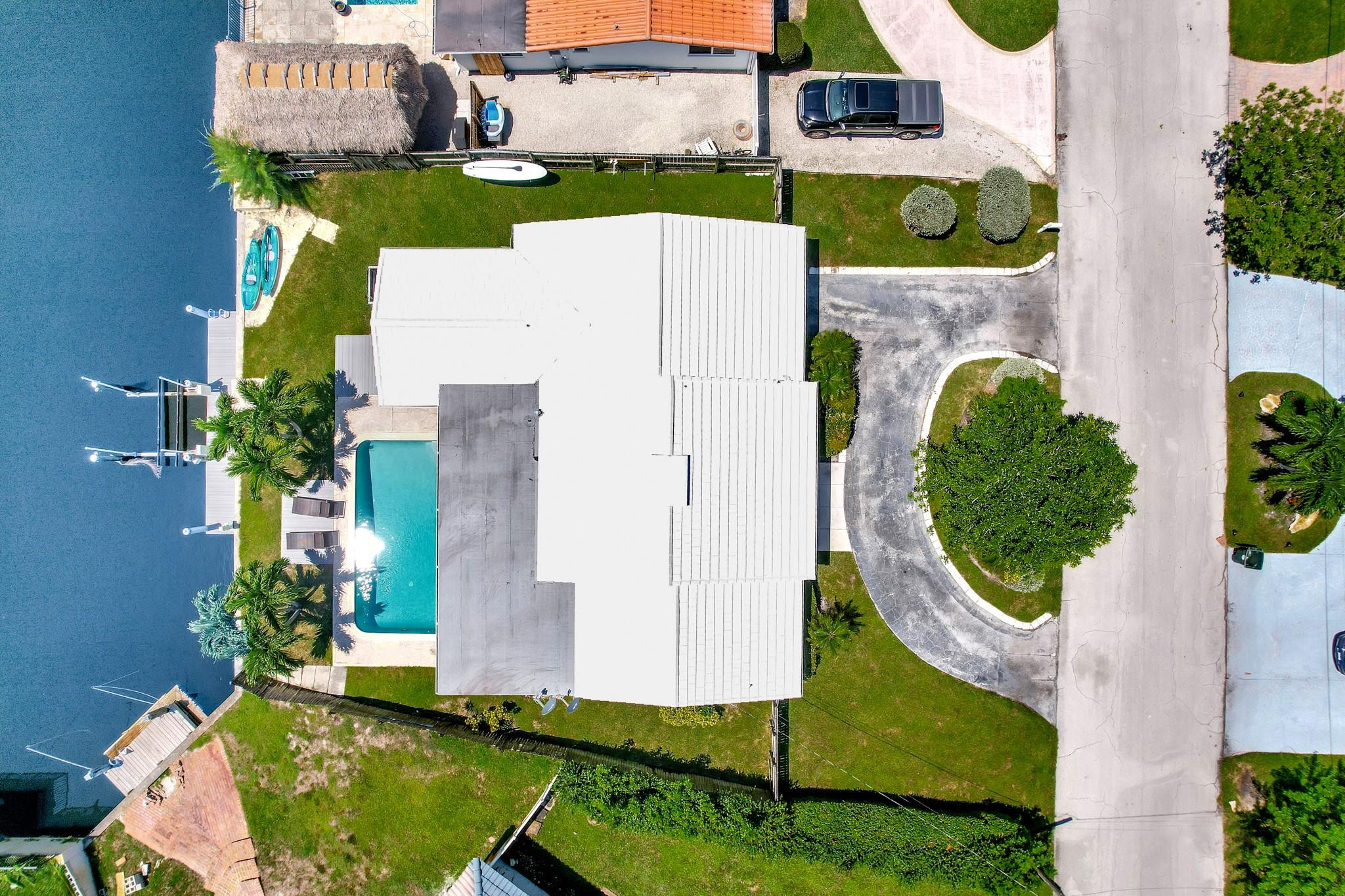 252 Southwest 14th Place Boca Raton, FL 33432 - Photo 43 of 49 an aerial view of a house with a swimming pool and outdoor seating