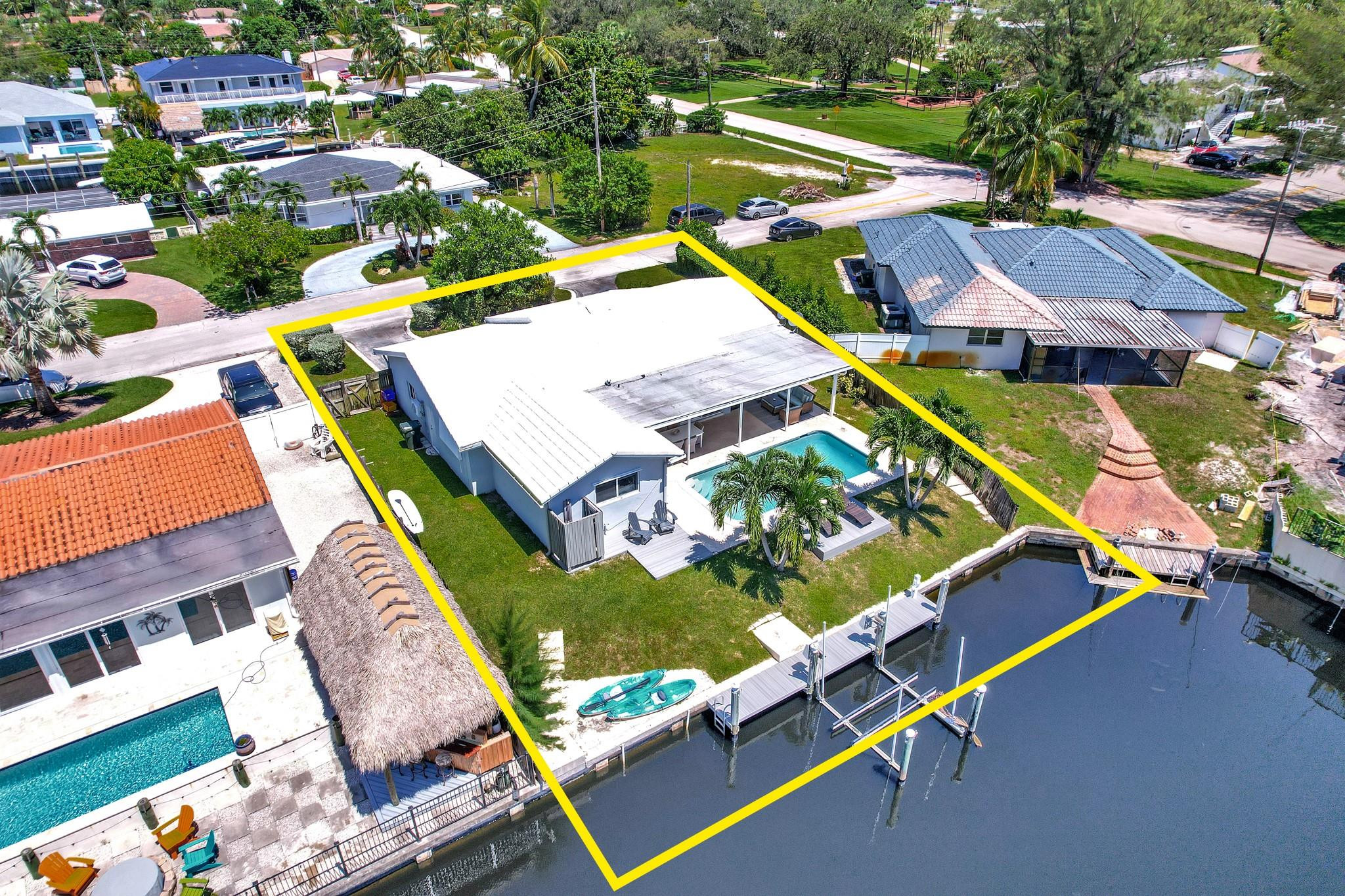 252 Southwest 14th Place Boca Raton, FL 33432 - Photo 6 of 49 an aerial view of a house with a garden and lake view