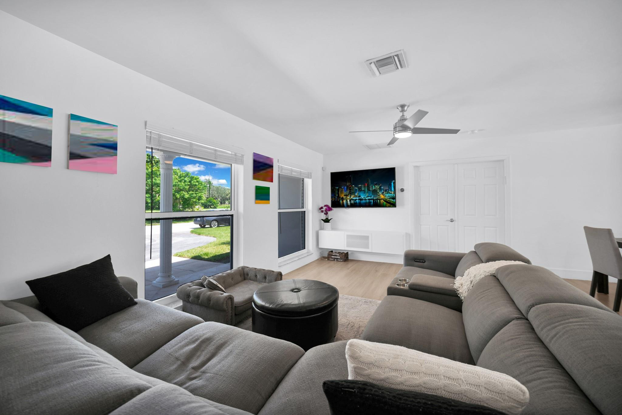 252 Southwest 14th Place Boca Raton, FL 33432 - Photo 9 of 49 a living room with furniture and a flat screen tv