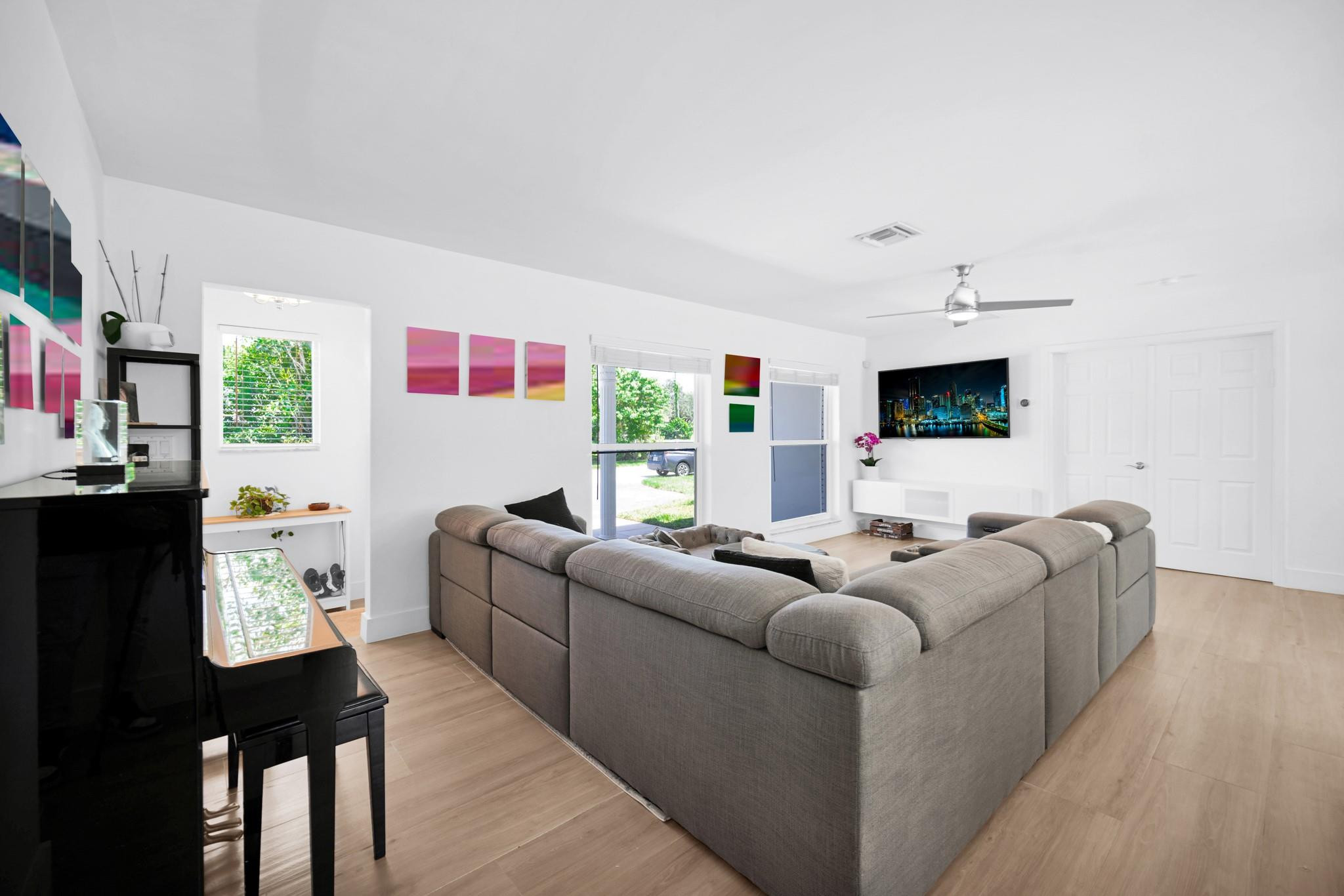 252 Southwest 14th Place Boca Raton, FL 33432 - Photo 10 of 49 a living room with furniture and a flat screen tv