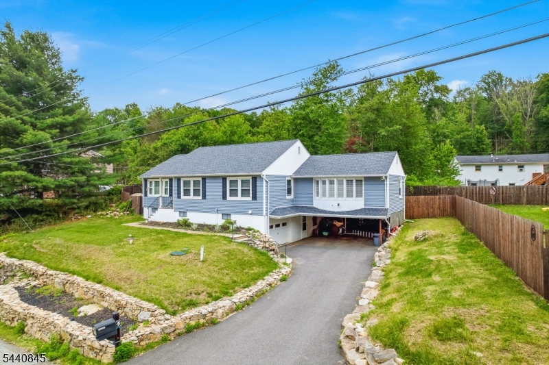 36 Forest Road Andover, NJ 07821 - Photo 18 of 50 a view of house with backyard outdoor seating and green space