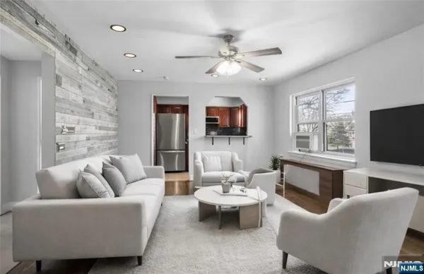 a living room with fireplace furniture and a flat screen tv