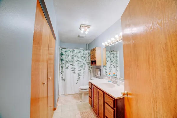 a bathroom with a sink a mirror and a shower