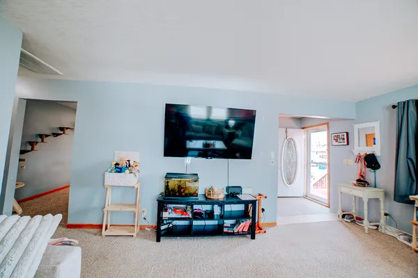 a living room with furniture and a flat screen tv