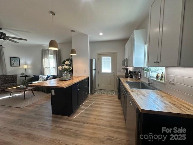 1224 Phillipsville Loop Canton, NC 28716 - Photo 11 of 22 a large kitchen with kitchen island a sink counter space and stainless steel appliances