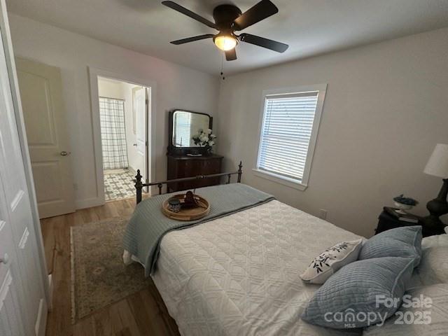 1224 Phillipsville Loop Canton, NC 28716 - Photo 14 of 22 a bedroom with a bed and a tv