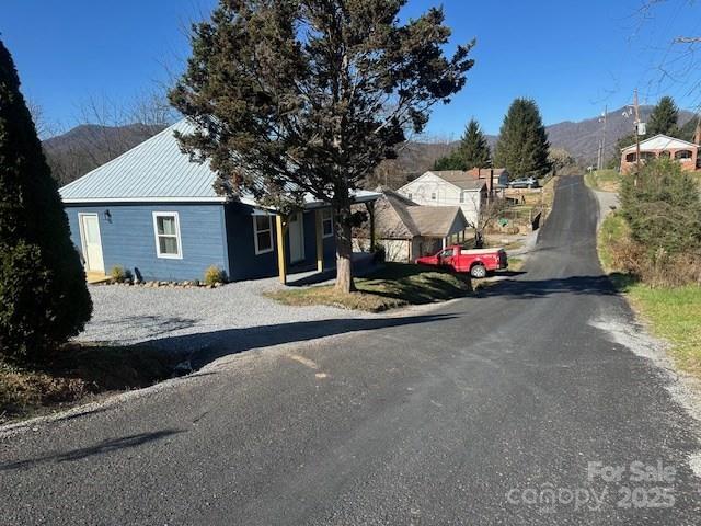 1224 Phillipsville Loop Canton, NC 28716 - Photo 6 of 22 a view of a house with large trees and center