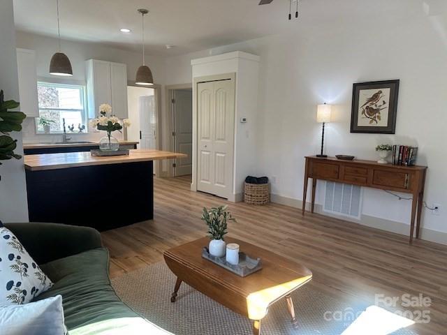 1224 Phillipsville Loop Canton, NC 28716 - Photo 7 of 22 a living room with furniture and a wooden floor