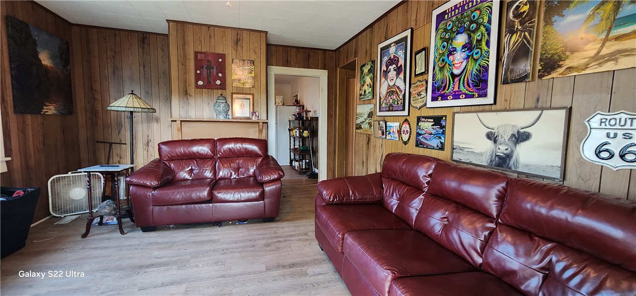 105 Hope Avenue Seneca, SC 29678 - Photo 6 of 33 Hardwood-paneled living room with an inviting, laid-back atmosphere.