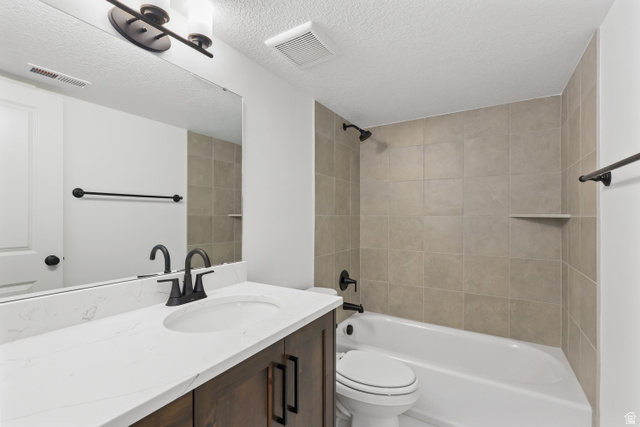 1139 South 4475 West West Point, UT 84015 - Photo 25 of 33 Bathroom with bathtub / shower combination, a textured ceiling, and vanity
