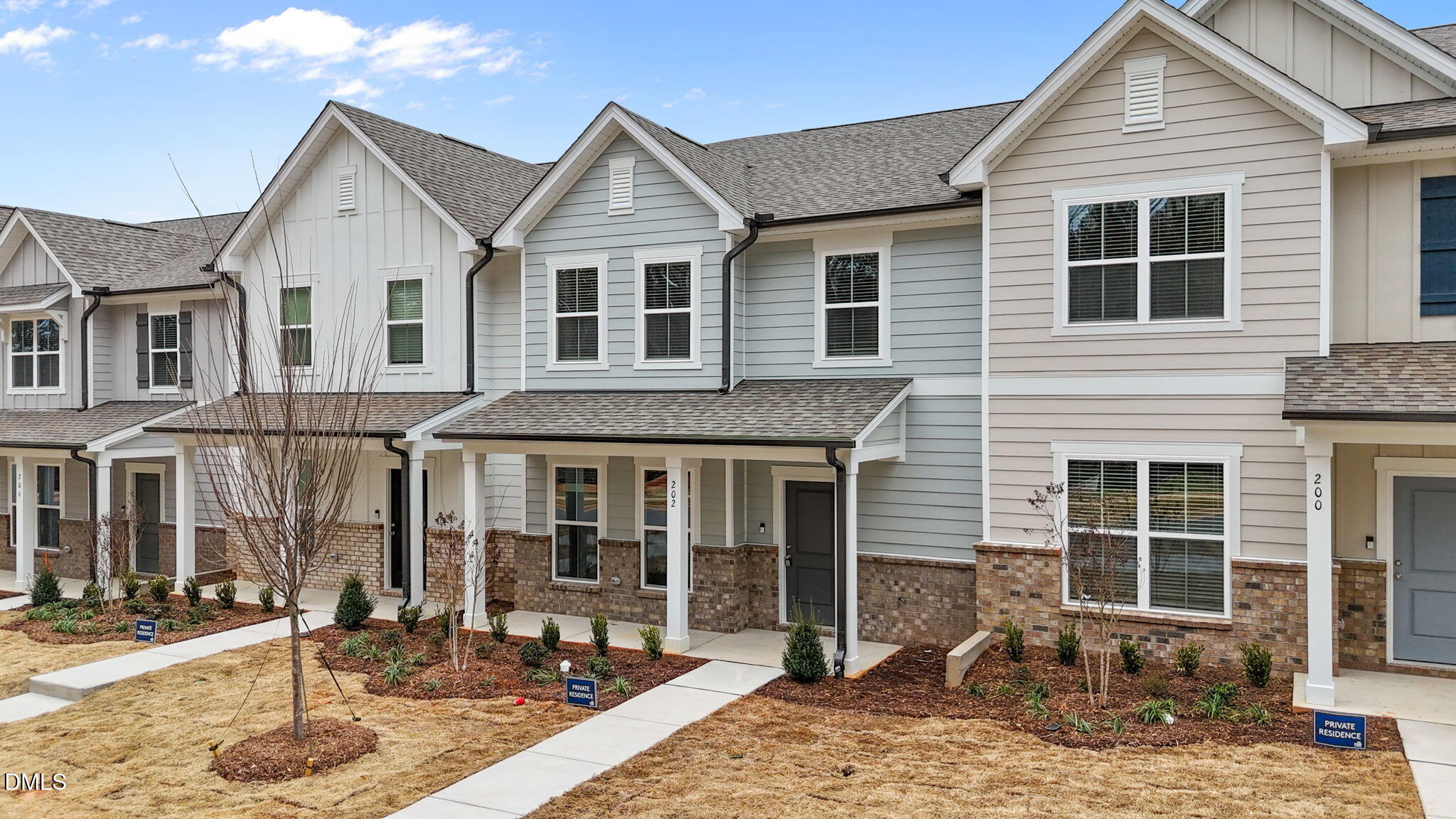 202 Fosterton Cottage Way Raleigh, NC 27603 - Photo 1 of 13 a front view of a house with a patio